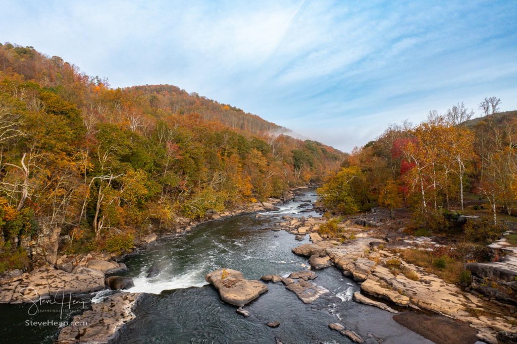 Valley Falls State Park near Fairmont in West Virginia on a colorful misty autumn day with fall colors on the trees