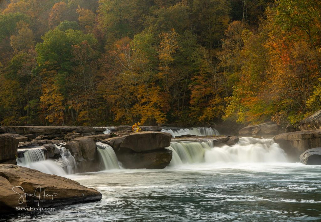 Valley Falls State Park near Fairmont in West Virginia on a colorful misty autumn day with fall colors on the trees