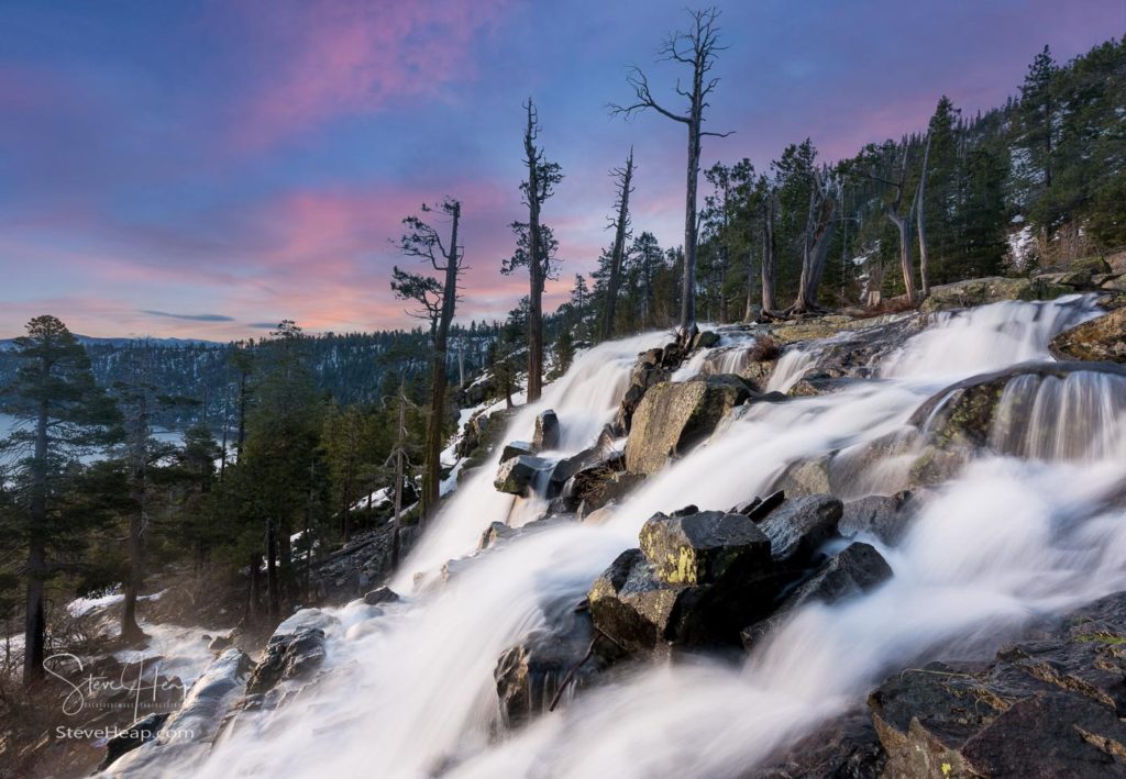 Sunrise at Emerald Bay on Lake Tahoe from the top of Lower Eagle Falls as the torrent of water from snow melt flows into the lake from Sierra Nevada Mountains