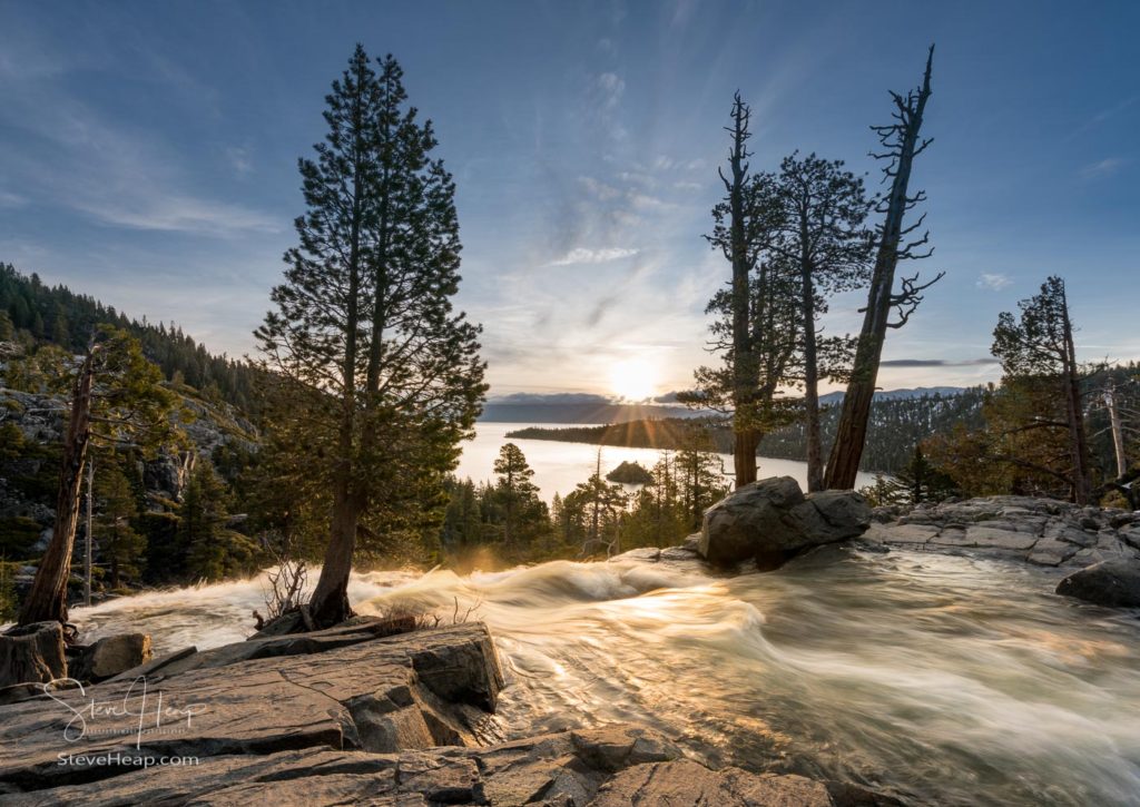 Sunrise at Emerald Bay on Lake Tahoe from the top of Lower Eagle Falls as the torrent of water from snow melt flows into the lake from Sierra Nevada Mountains