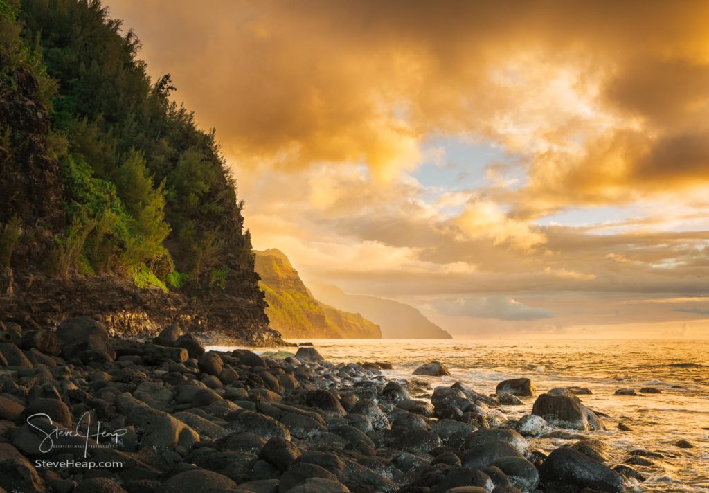 Sun setting over the receding headlands of the Na Pali coast from Ke'e Beach on north of Kauai, Hawaii. Prints available in my store