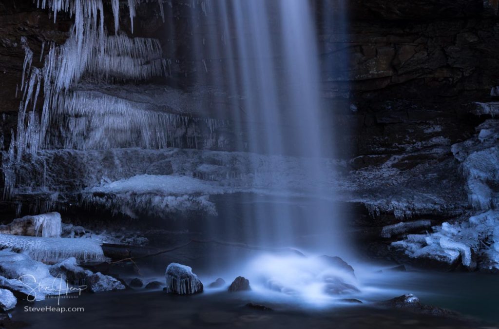 Icy water around the base of Cucumber Falls in the Ohiopyle state park in Pennsylvania in winter