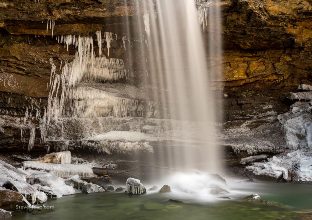 Icy water around the base of Cucumber Falls in the Ohiopyle state park in Pennsylvania in winter. Prints available in my online store