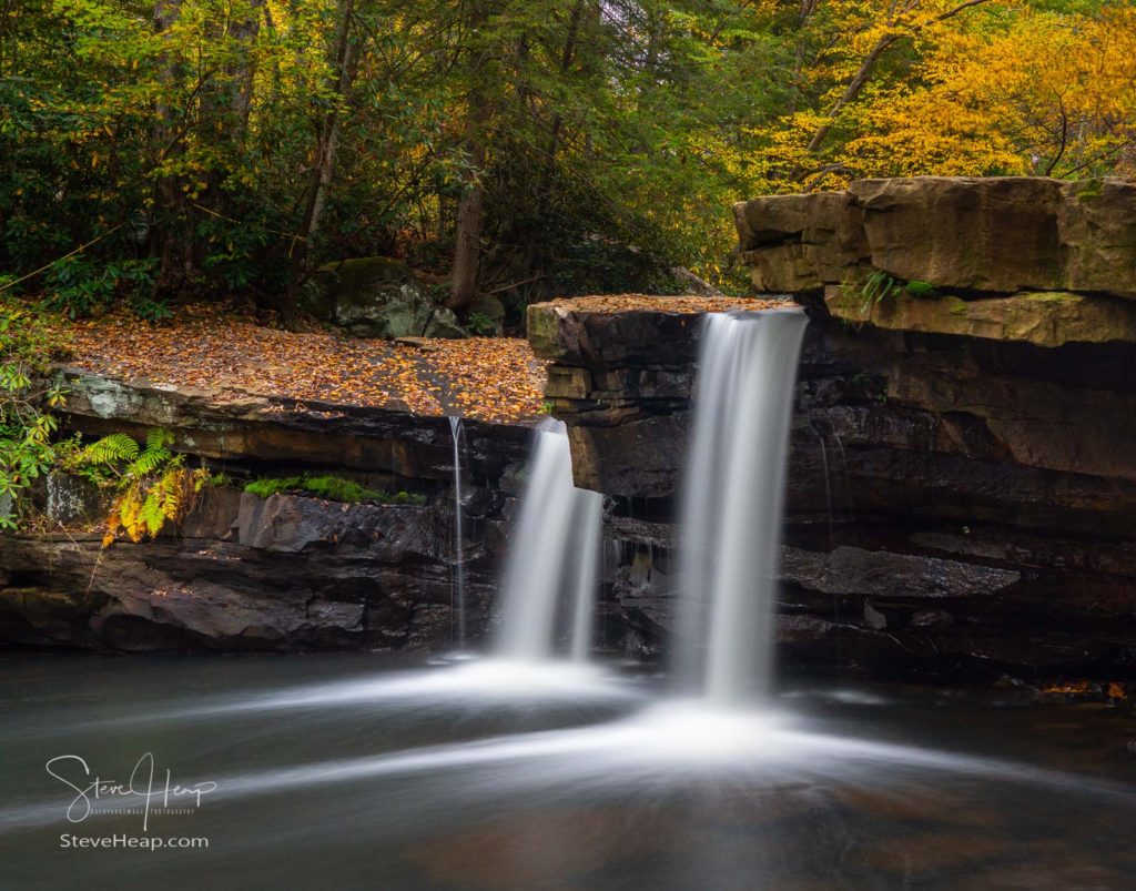 Cascade of waterfall into swimming hole with blurred motion on Deckers Creek running by Route 7 near Masontown in Preston County West Virginia