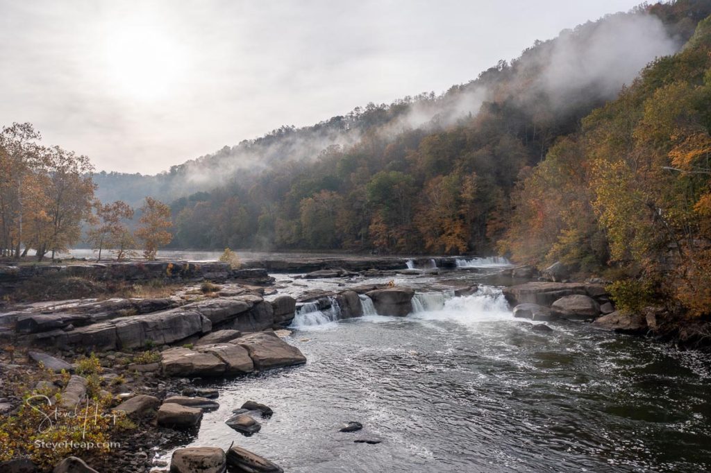 Valley Falls State Park near Fairmont in West Virginia on a colorful misty autumn day with fall colors on the trees