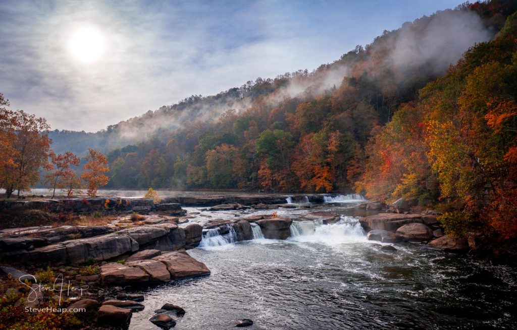 Valley Falls State Park in West Virginia on a colorful misty autumn day with fall colors on the trees. Full product details can be found in my online store