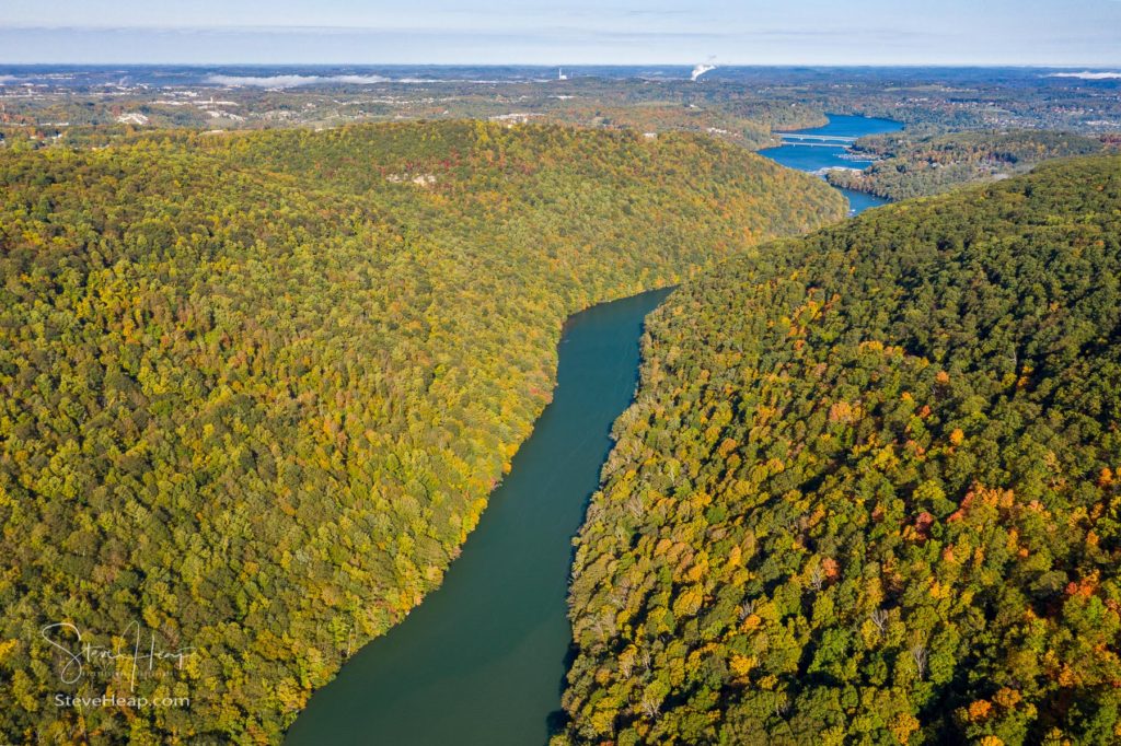 Aerial drone image of the Cheat River flowing through narrow wooded gorge in the autumn towards Cheat Lake.