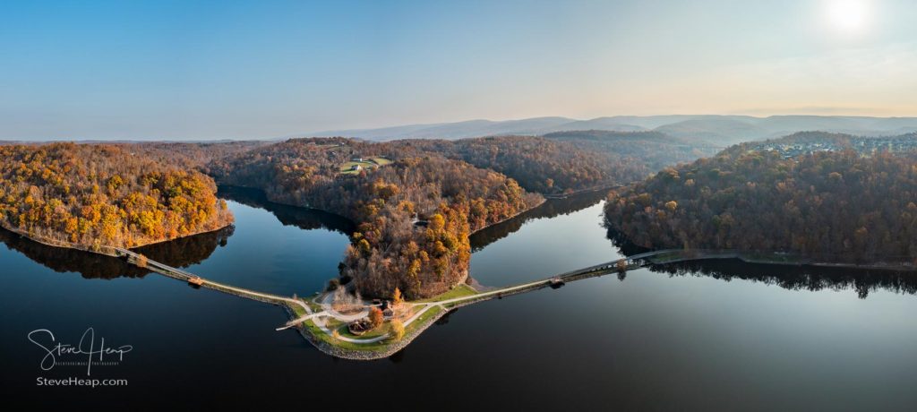 Early sun casts warm light on the park at Cheat Lake near Morgantown West Virginia on a beautiful calm autumn day