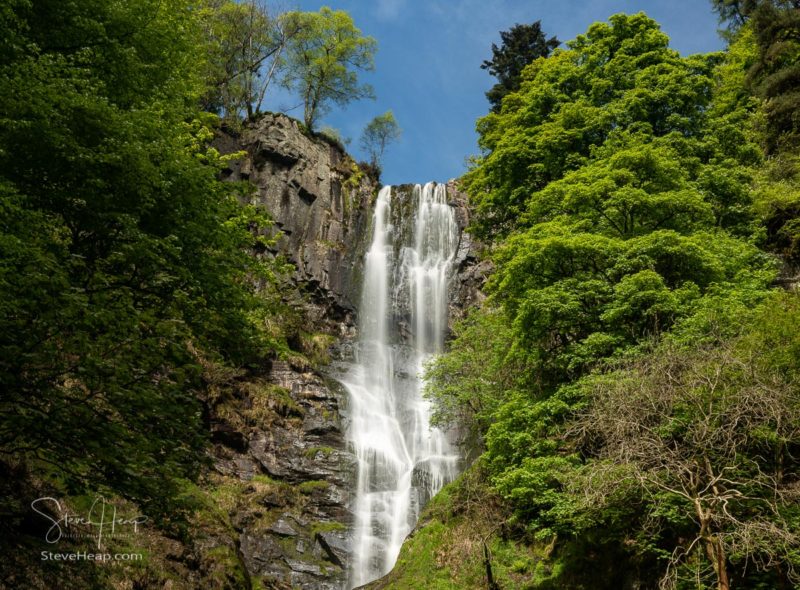 High falling water in waterfall and cascades at head of Pistyll Rhaeadr falls in Wales