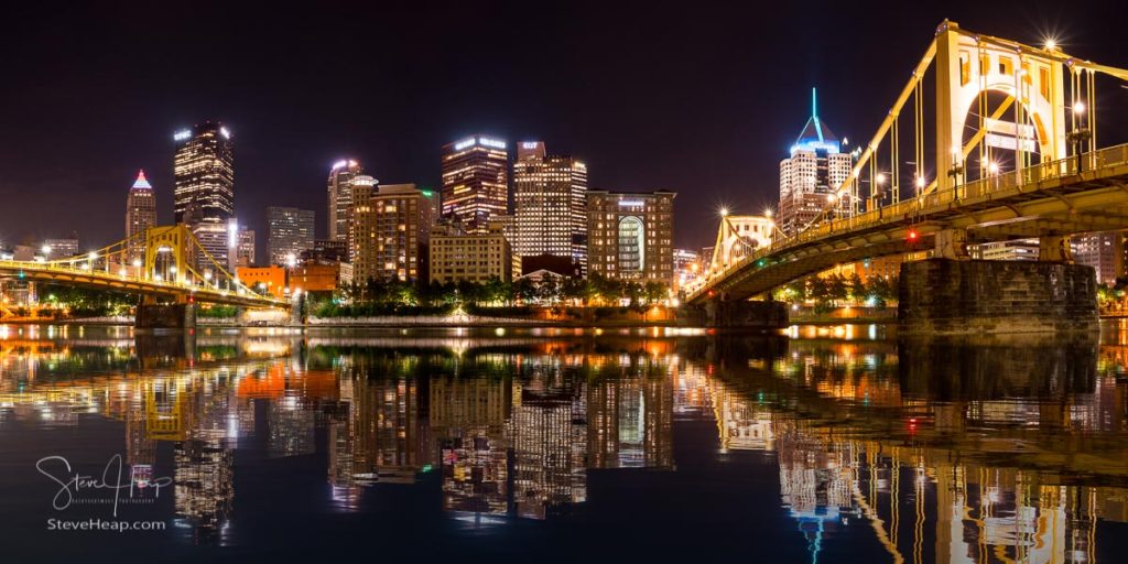 Reflections of downtown Pittsburgh from river trail on North Side at night. Prints available in my store