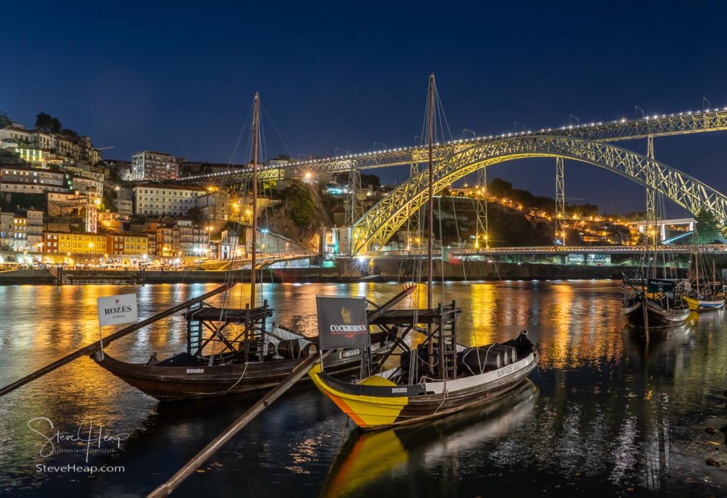 Night view of Rabelo boats and cityscape of Porto from the banks of the river Douro. Prints available from my online store