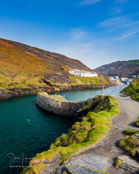 Traditional narrow path or street leading past old houses and cottages in Boscastle, Cornwall, England, UK