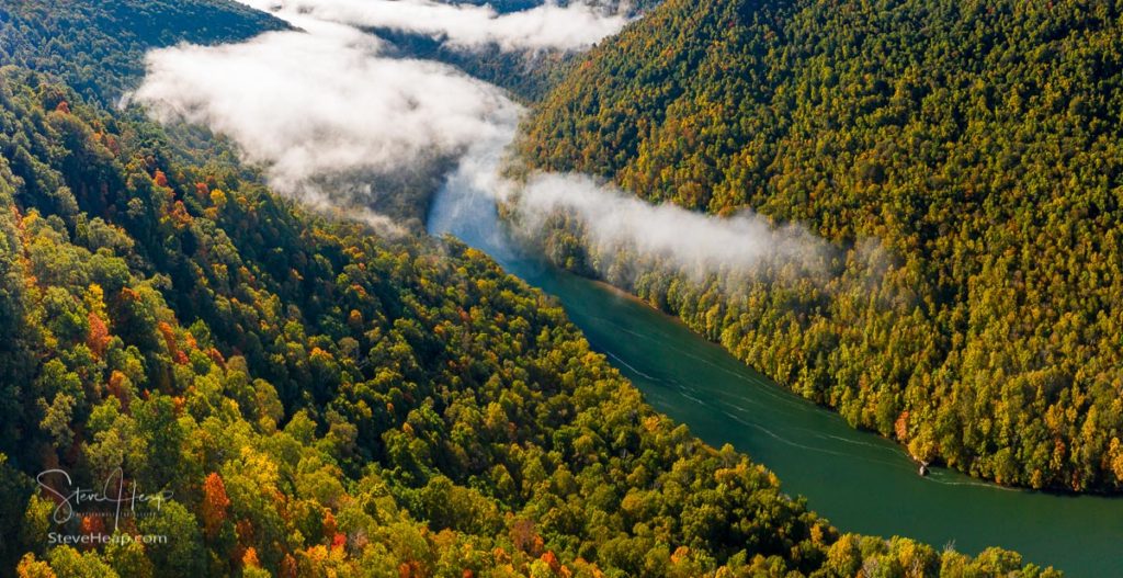 Aerial drone image of the Cheat River flowing through narrow wooded gorge in the autumn towards Cheat Lake. Prints available here