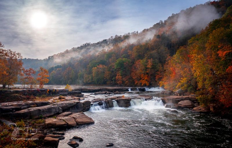 Valley Falls State Park near Fairmont in West Virginia on a colorful misty autumn day with fall colors on the trees