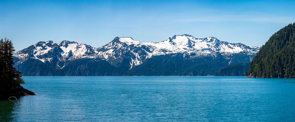 Wide panorama of snow-covered peaks of the mountains overlooking Resurrection Bay near Seward in Alaska. Prints available online here