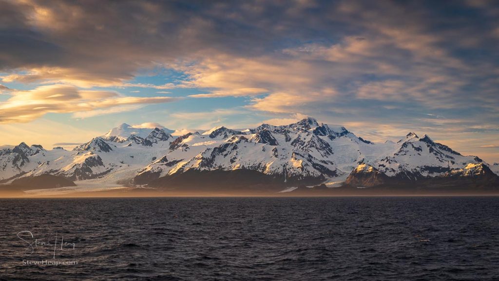 The start of the sunset at around 9pm Alaska time in a high-definition panorama of the mountains with slanting light from the sun
