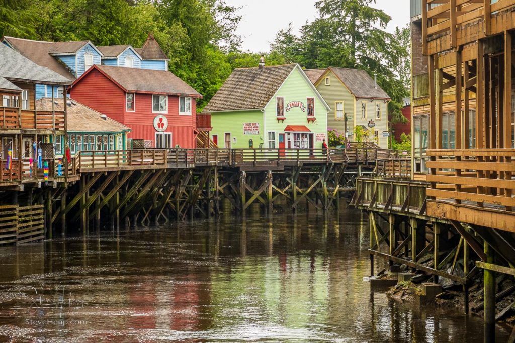 Famous Creek Street boardwalk and shops in Ketchikan Alaska with Dolly's in light green. Prints available in my online store