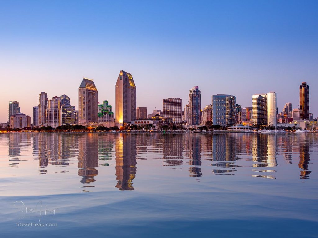 Sunset illuminating the tall skyscrapers of San Diego in California from Centennial Park in Coronado with artificial water reflection. Prints available here