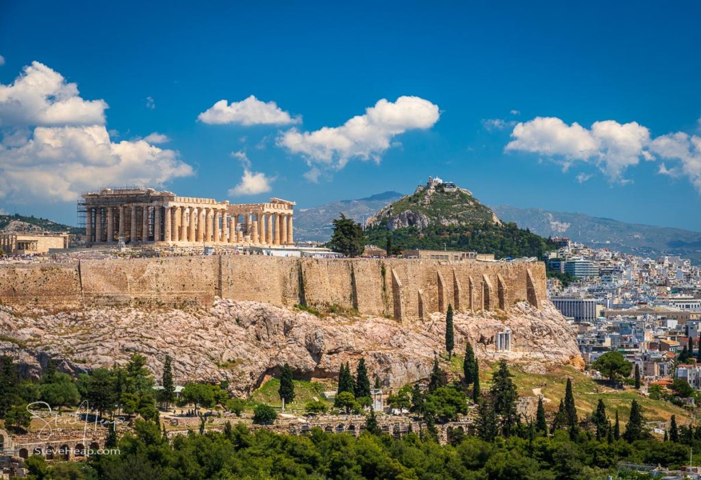 Acropolis and Lycabettus Hill framed by trees from summit of Filopappou Hill. Prints in my online store