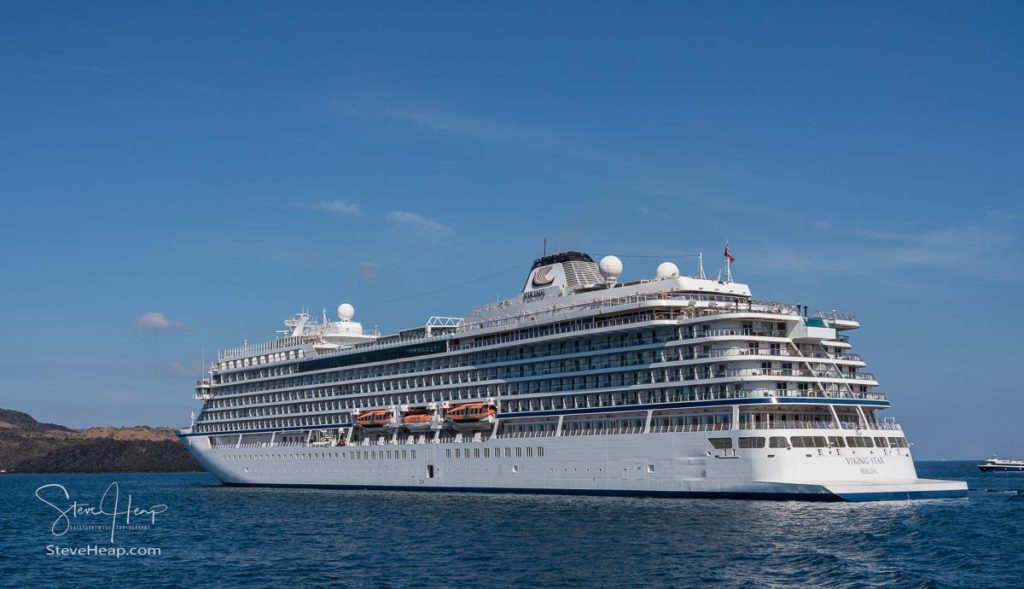 Viking Star cruise ship bringing tourists to island of Santorini as we are ferried to the coast