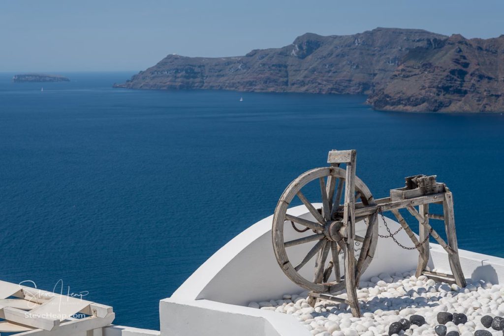 Old wooden spinning lathe above blue ocean in Santorini