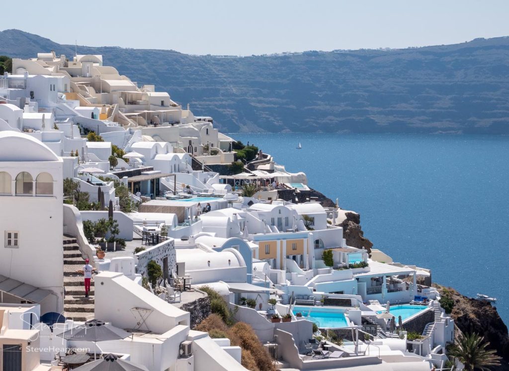 Crowded cave houses on cliff in village of Oia on Santorini