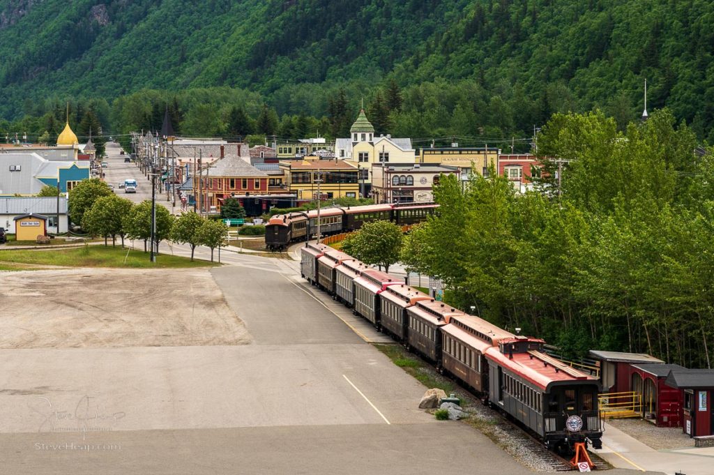 Skagway, AK - 6 June 2022: White pass tourist train in small Alaskan town of Skagway