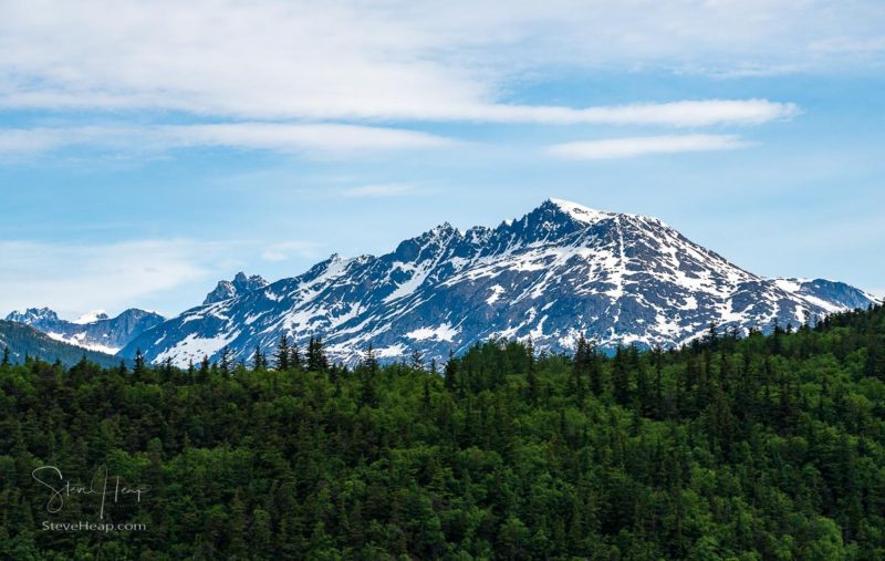 Snow topped mountains that formed the passes that the gold rush miners had to cross near Skagway Alaska