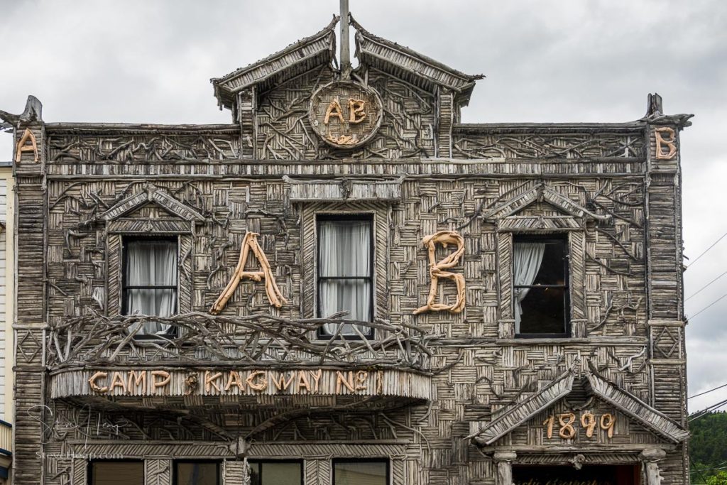 Skagway, AK - 6 June 2022: Unusual carved wood and branch store on shopping street in Alaskan town of Skagway