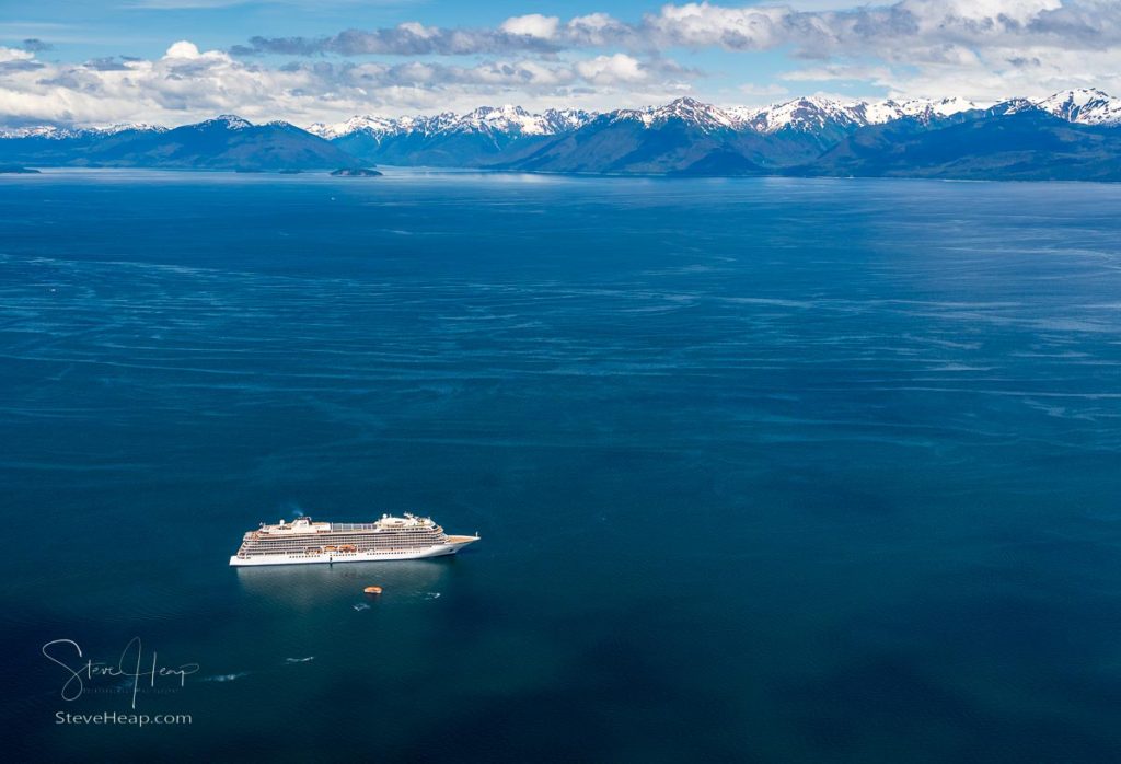 Hoonah, AK - 7 June 2022: Viking Orion cruise ship anchored at Icy Strait Point Alaska with passenger tenders. Prints available in my store.