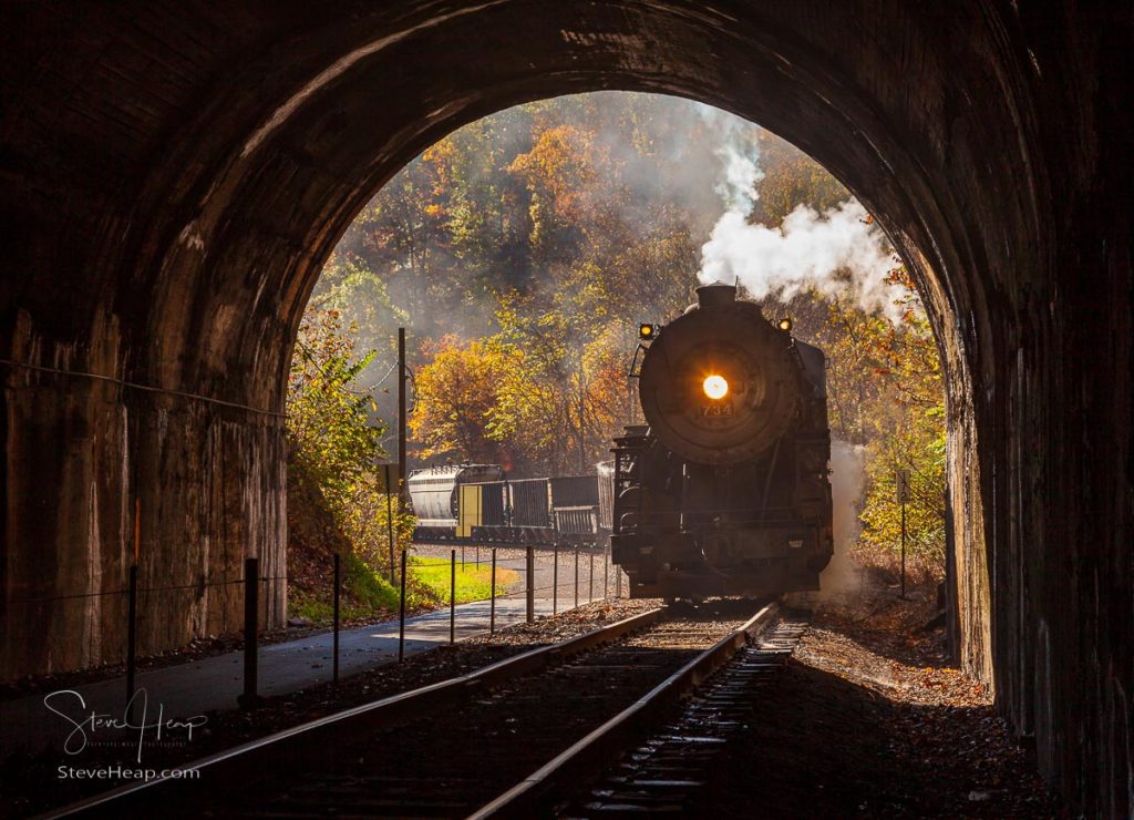 Old 1916 Baldwin steam train on WMRR pulling into a tunnel belching steam and smoke. Prints available in my store