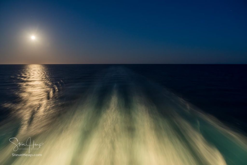 Moon rising over wake and waves of cruise ship at sea after leaving Athens. Prints in my online store