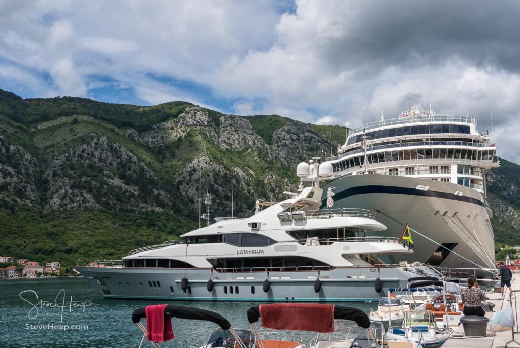 Prow of Viking Star above expensive yacht in Kotor, Montenegro
