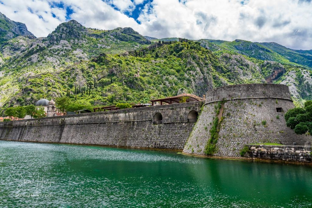 Solid stone walls surround the old town Kotor in Montenegro