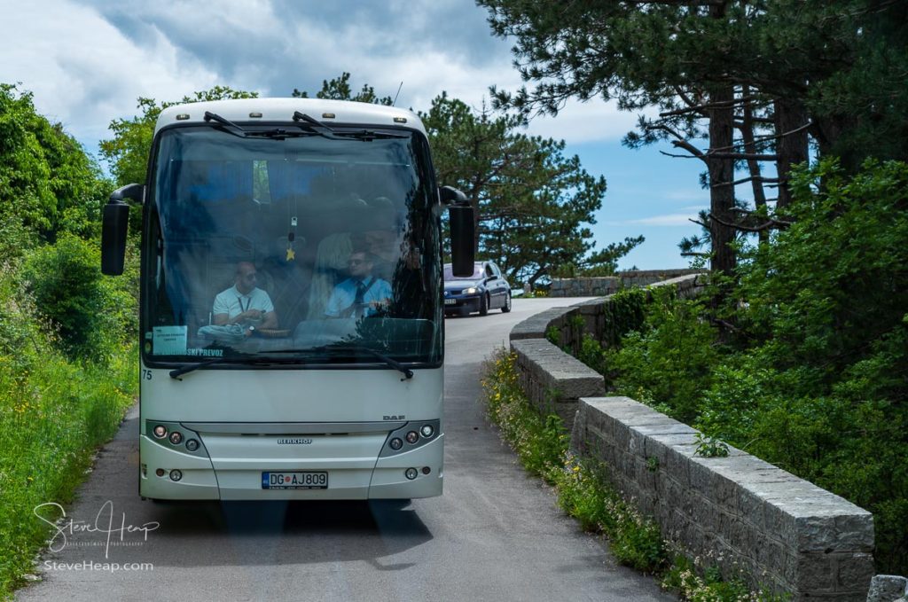 Coach reversing up the narrow road that leads from Kotor over the mountains