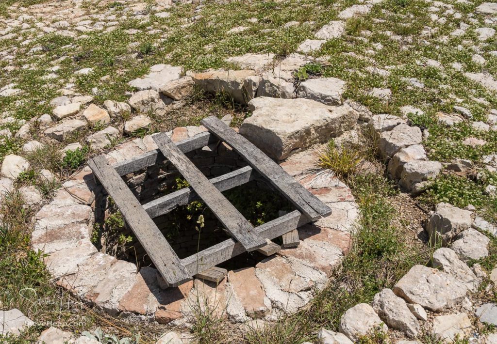 Stone well in the ruins of old Venetian fort above the coastal town of Novigrad in Croatia