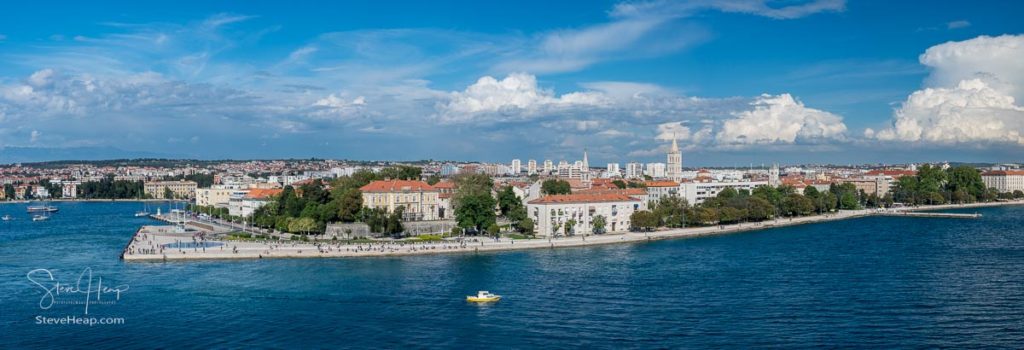 People on the promenade watching departure of cruise ship from the port of Zadar