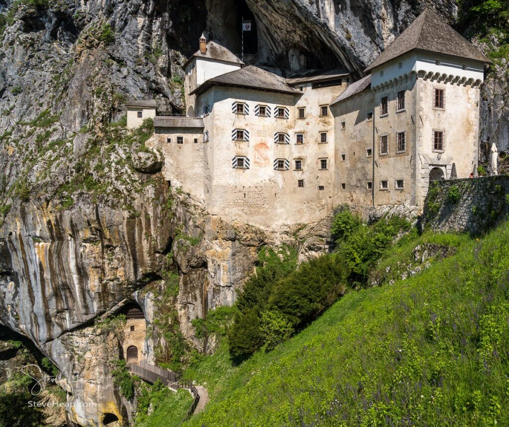 Famous castle of Predjama built into a cave in mountain in Slovenia