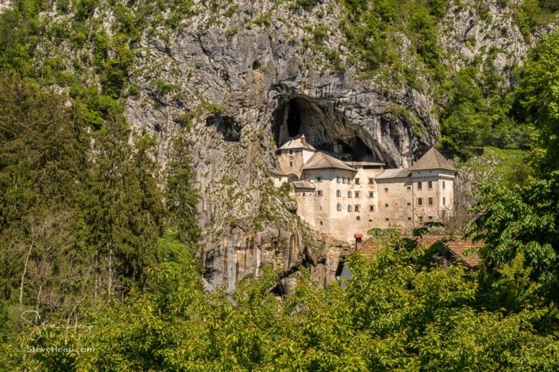 Famous castle of Predjama built into a cave in mountain in Slovenia
