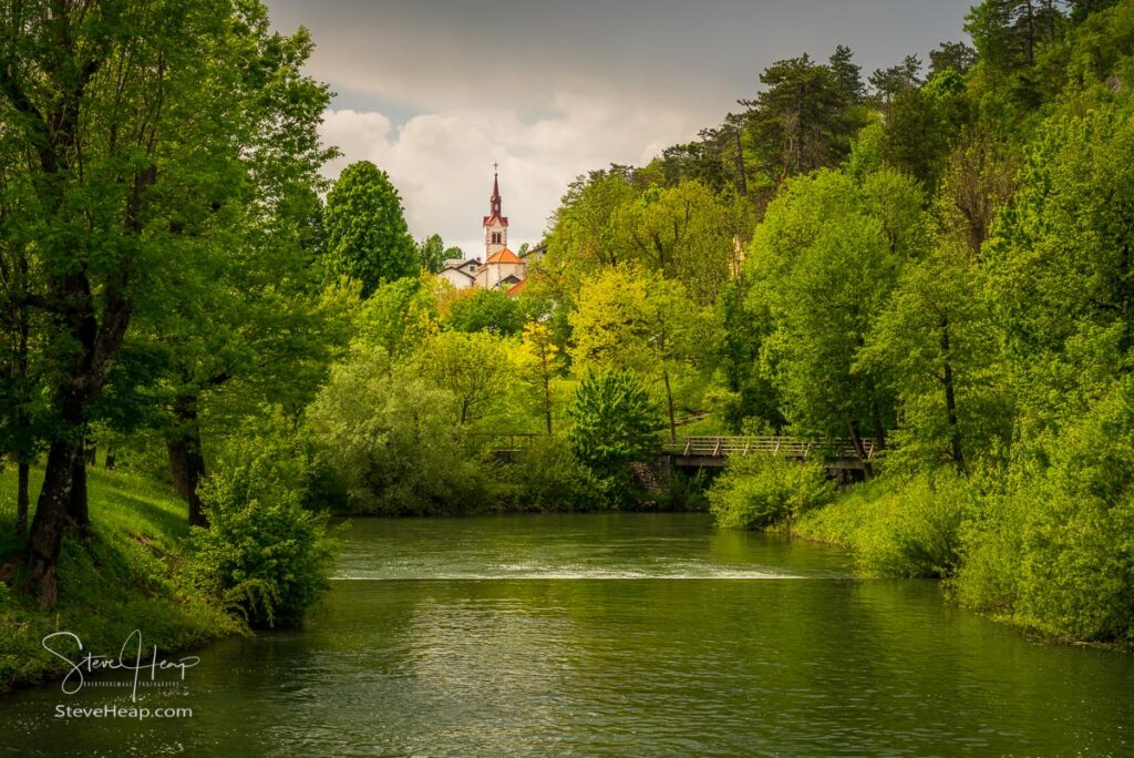 Calm and peaceful river in the park by Postojnska Jama in Slovenia. Prints in my store