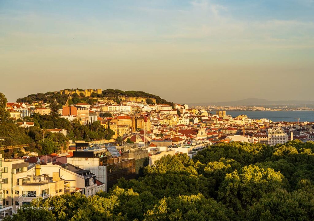 Castle and cathedral in downtown Lisbon illuminated by the setting sun