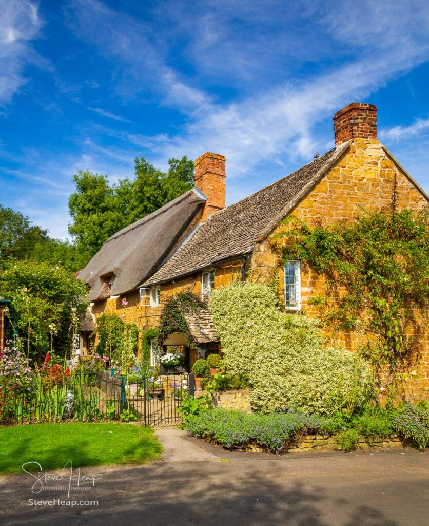 Ancient cotswold stone house and flower garden in Cotswold village of Ilmington. Prints in my online store