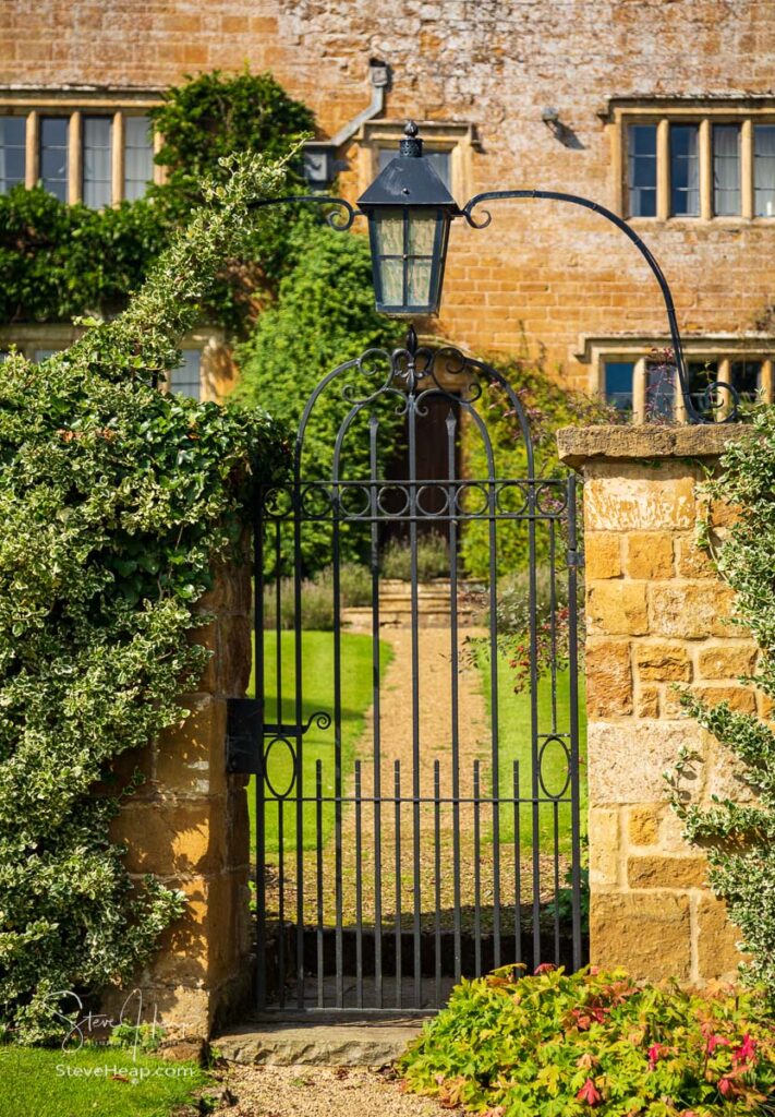 Gateway and gate leading to old cotswold stone house and flower garden in the village of Ilmington. Prints in my store