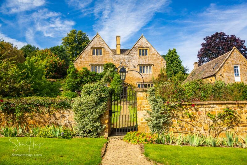 Ancient cotswold stone house and flower garden in Cotswold village of Ilmington