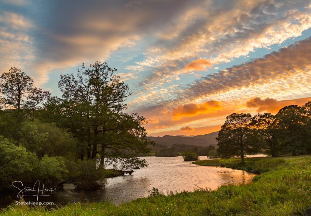 Setting sun illuminates clouds over Rydal Water in English Lake District. Prints available in my store