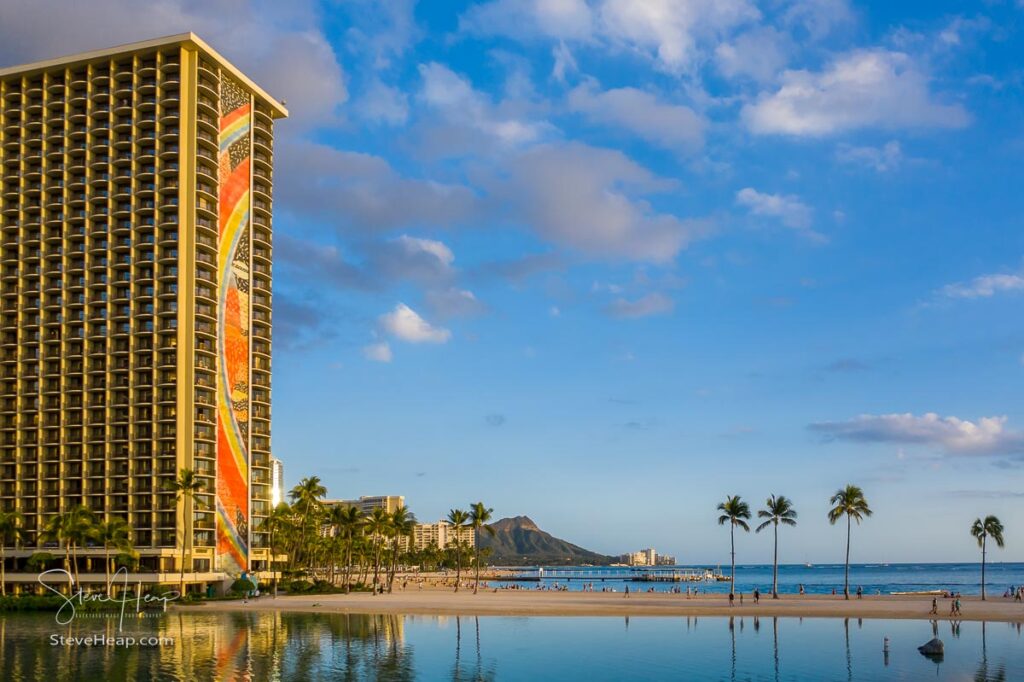 Hilton Rainbow Tower in front of the shoreline towards Diamond Head on Waikiki Beach in Hawaii