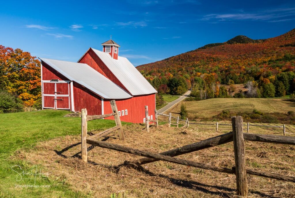 Grandview farm barn by the side of the track near Stowe in Vermont during the autumn color season. Prints in my store