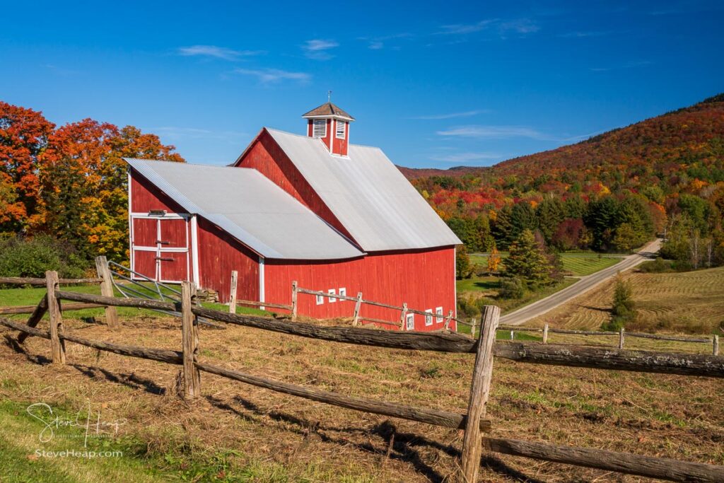 Grandview farm barn by the side of the track near Stowe in Vermont during the autumn color season. Prints in my online store