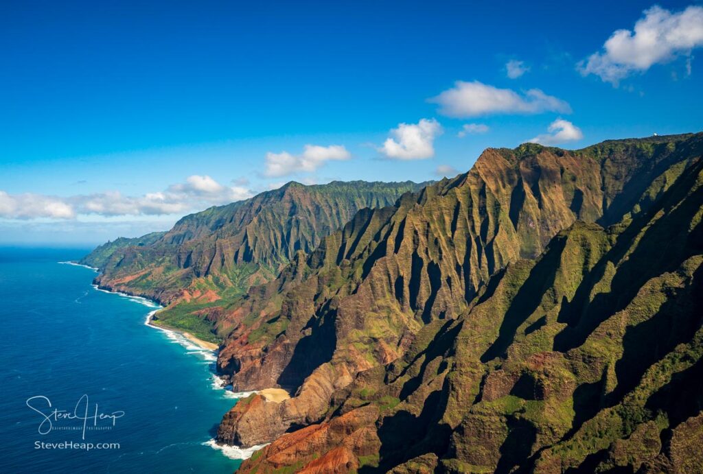 Aerial view of Na Pali coastline and landscape of hawaiian island of Kauai from helicopter flight