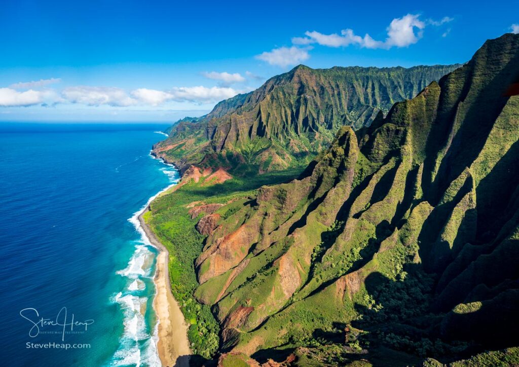 Aerial view of Na Pali coastline and Kalalau beach on Hawaiian island of Kauai from helicopter flight. Prints available here